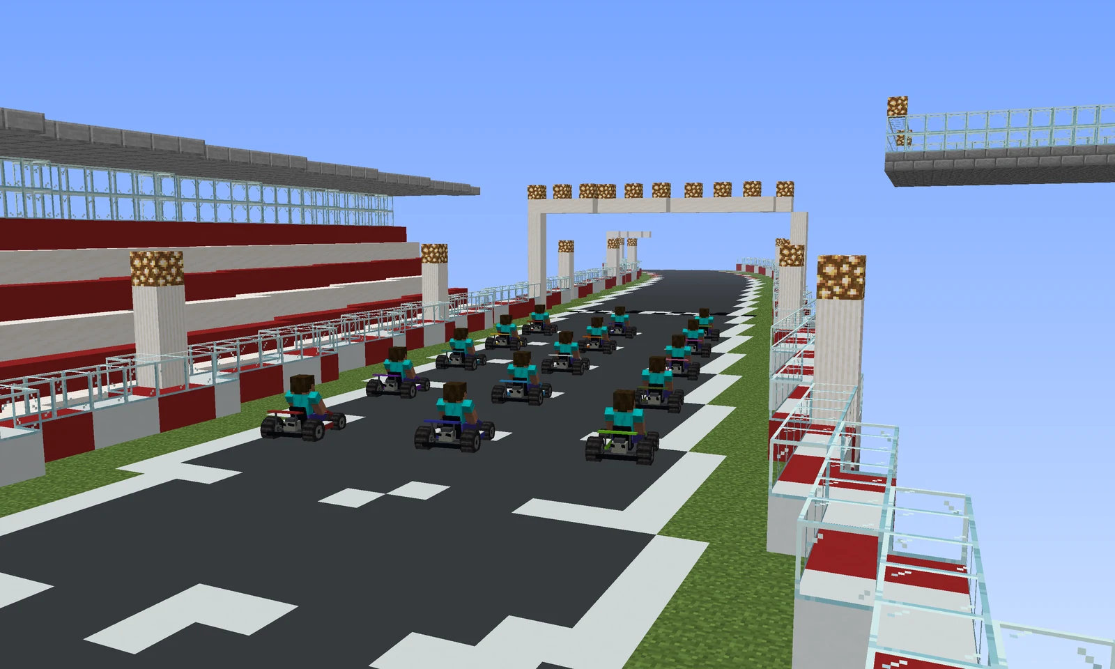 Go-karts lined up on the main straight of a generated circuit